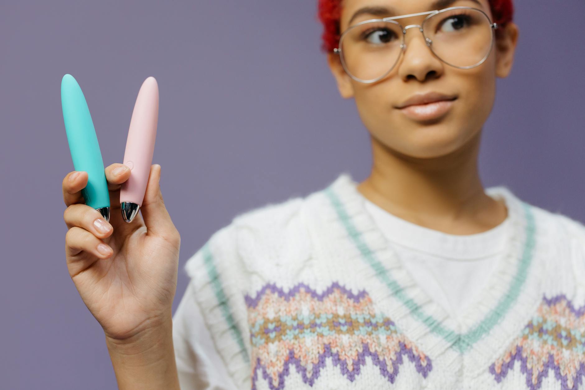 A close-up arrangement of colorful vibrators showcasing different textures and designs for clitoral stimulation